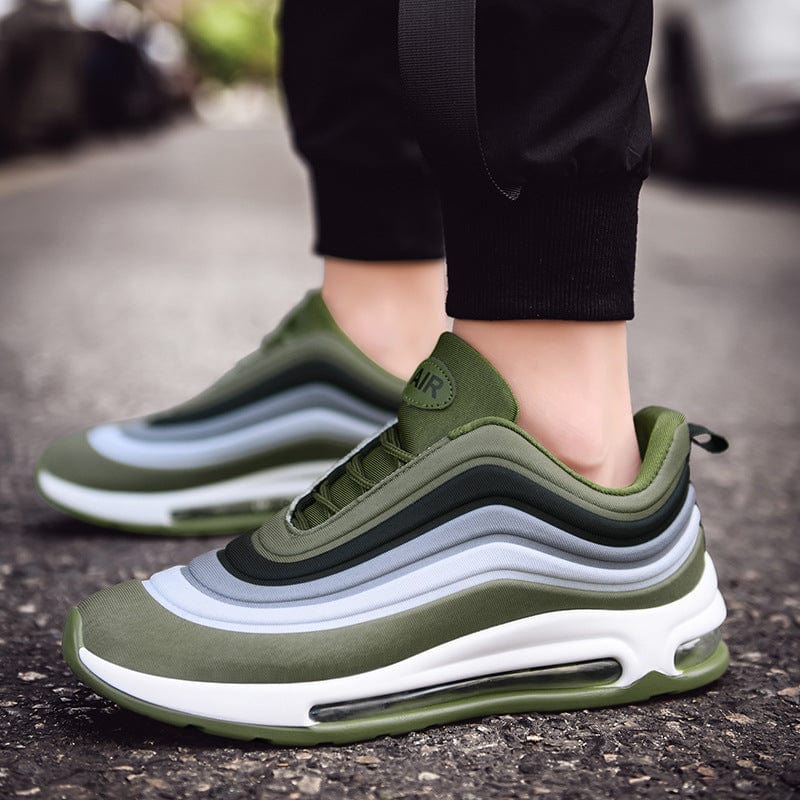 green white sneakers remix air flashlander left side air shoes man standing with shoes