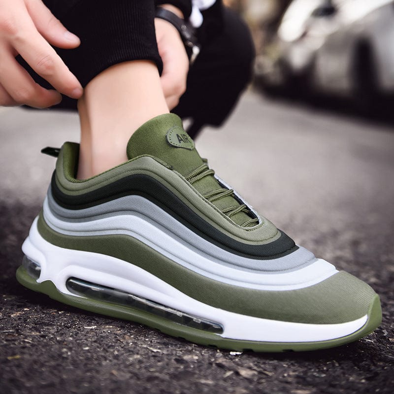 green white sneakers remix air flashlander right side air shoes man showing shoes on street