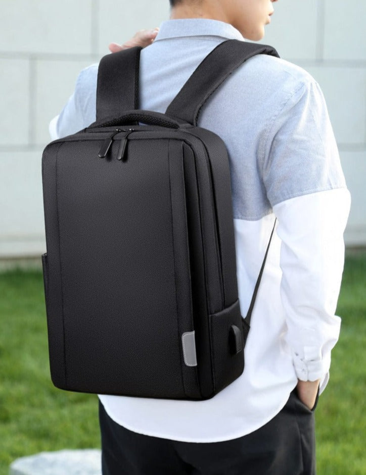 black backpack anti theft traveli flashlander man using backpack