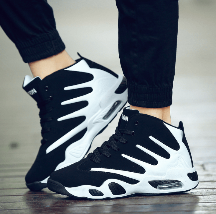 black white sneakers claw flashlander left side basketball sneakers pair man walking with shoes