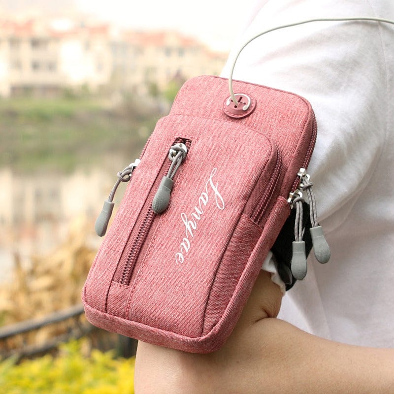 pink cell phone bag and phone waist bag front side earphone pocket and hole for running and listening hands free person using