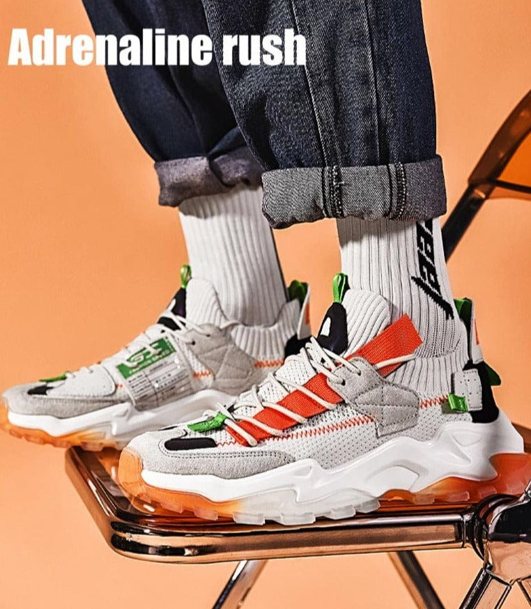 orange men´s sneakers vesta flashlander pair model on chair adrenaline rush