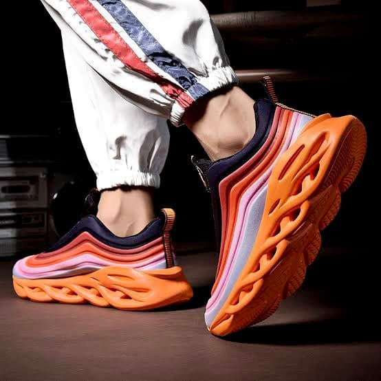 orange sneakers remix flashlander men model showing shoes walking in home