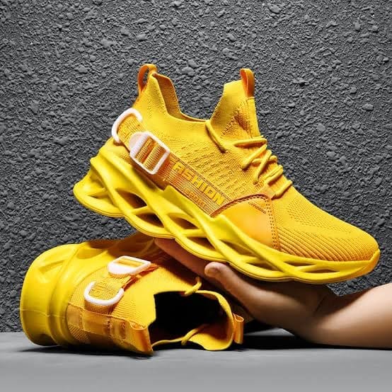yellow sneakers gladiator flashlander right side model holding shoe
